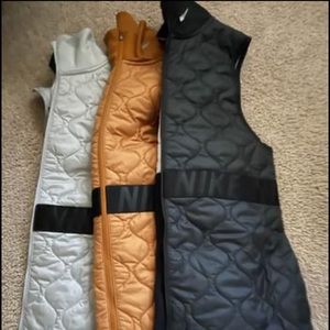 Nike vests in Gray, Gold, black and I have one of each color in XS.